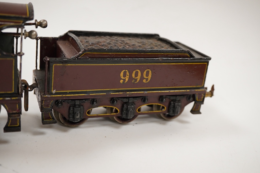 An 0 gauge Bing clockwork tinplate Midland Railway 4-4-0 tender locomotive, 999, in maroon livery with yellow and black lining and original clockwork mechanism